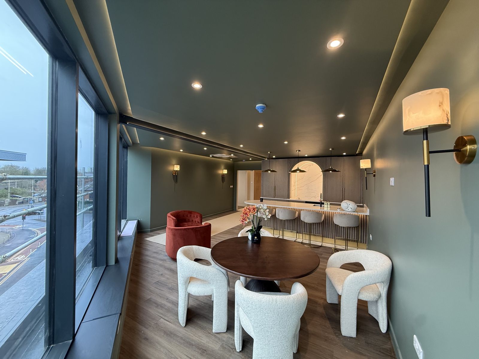 Dining area with downlights, wall lights and LED cove lighting